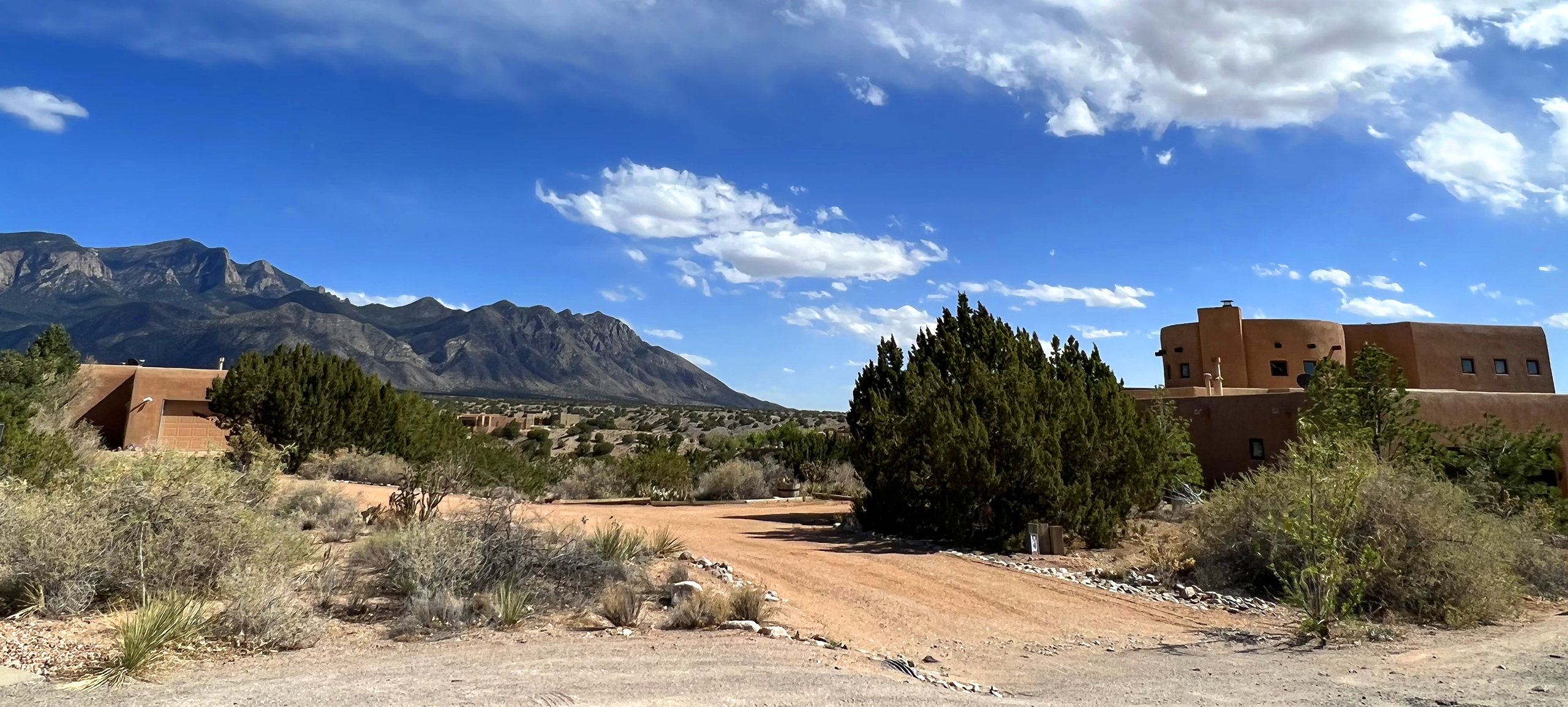 View of pueblo style homes in Placitas near the mountains of New Mexico